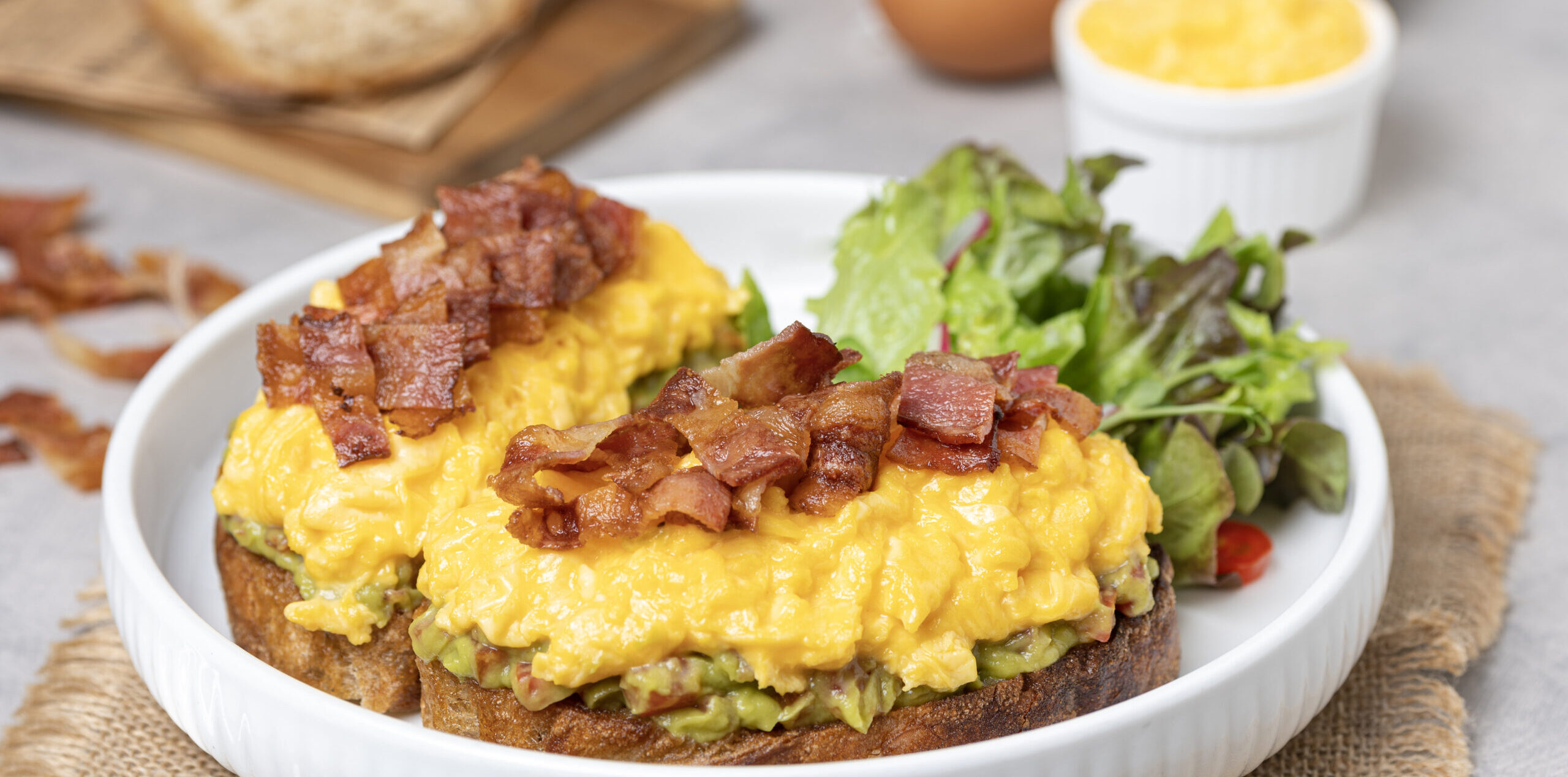 Avocado toast with scrambled egg and crispy bacon รีทัชแล้ว 8 scaled e1757575538147