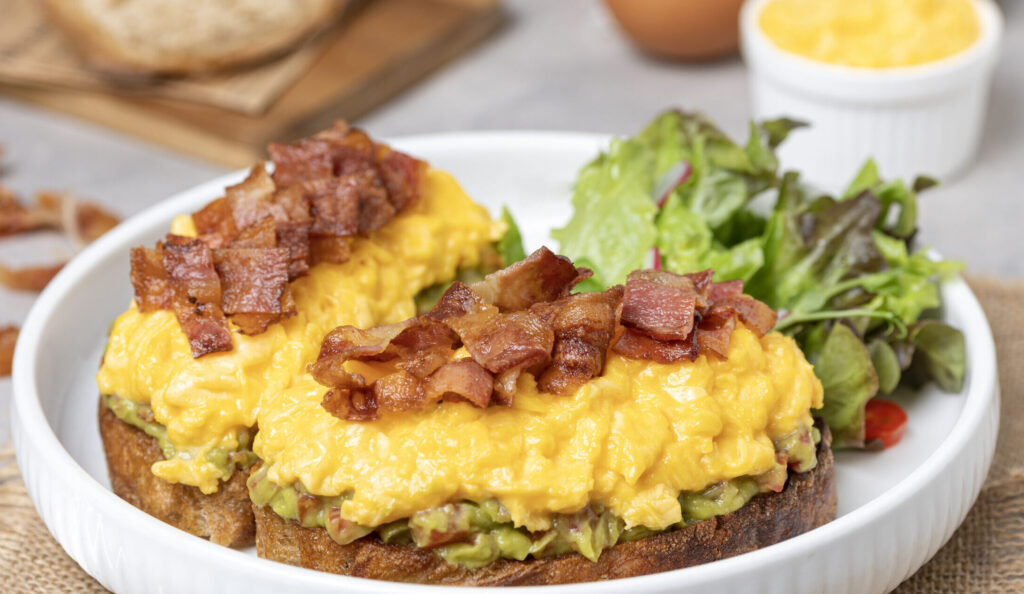Avocado toast with scrambled egg and crispy bacon รีทัชแล้ว 8 scaled e1758621508800